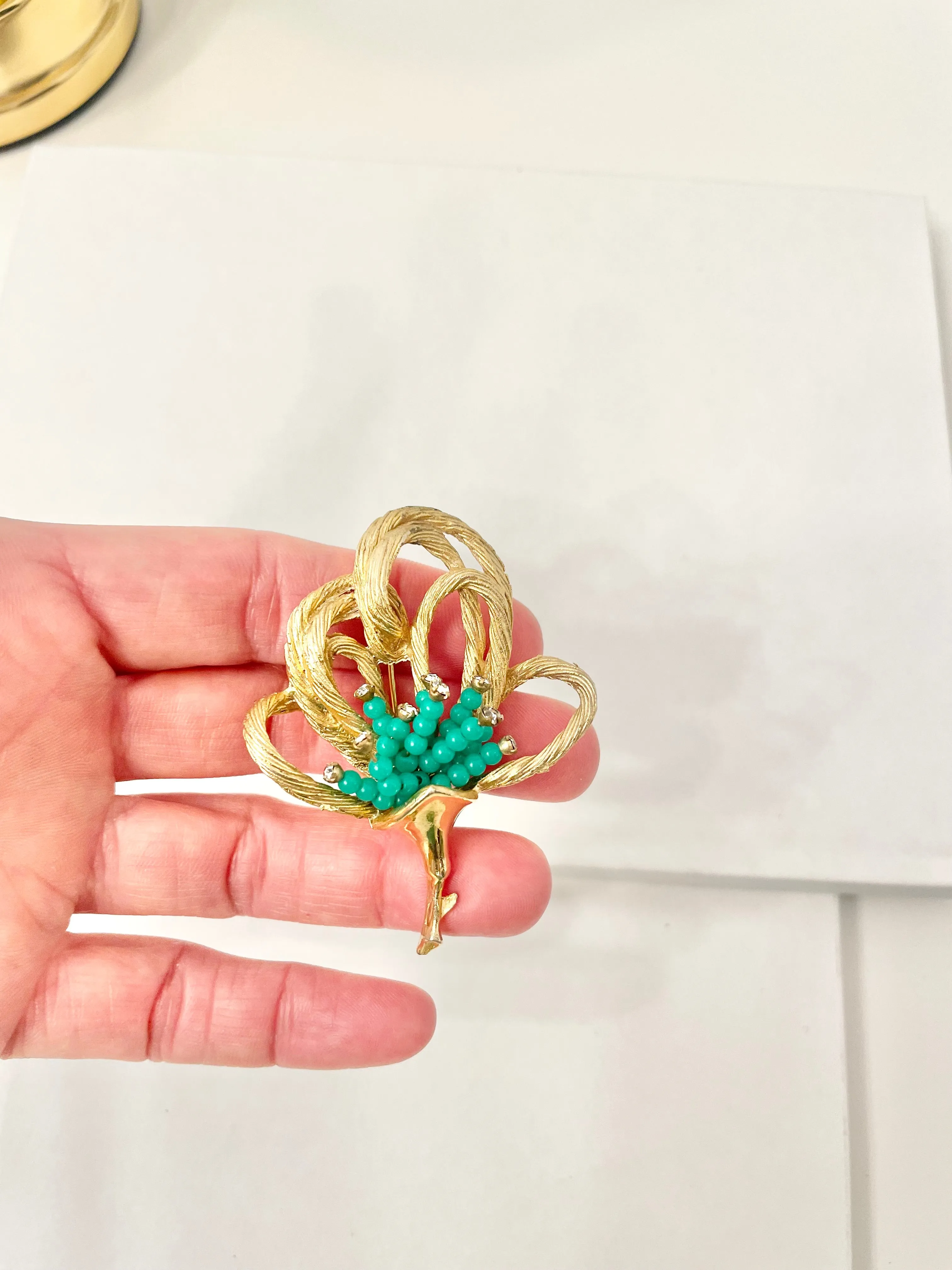 A truly classic brooch for a classy lady... love this bottle green beaded brooch with a sprig of clear glass stones, set in gold! so lovely