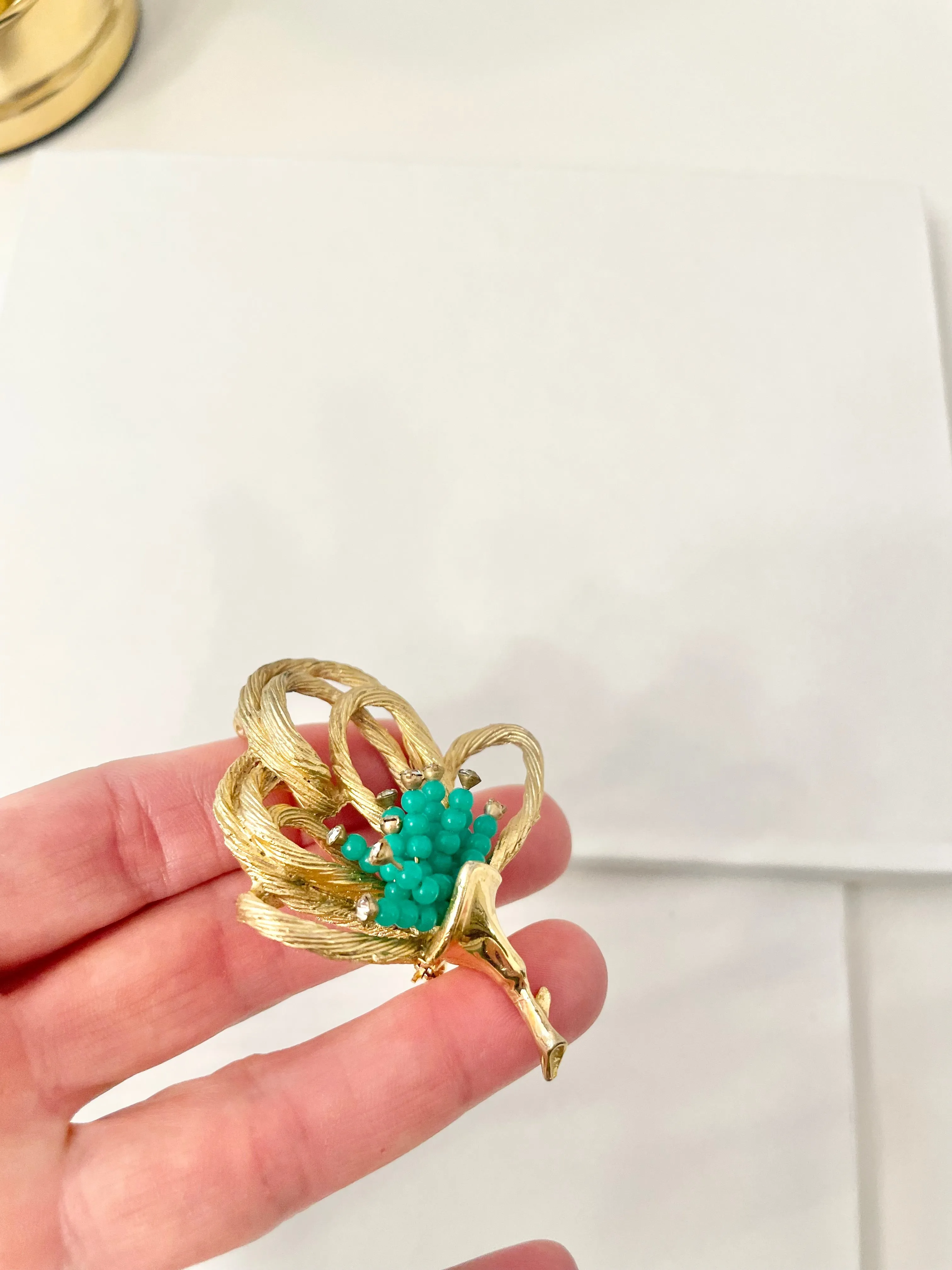 A truly classic brooch for a classy lady... love this bottle green beaded brooch with a sprig of clear glass stones, set in gold! so lovely