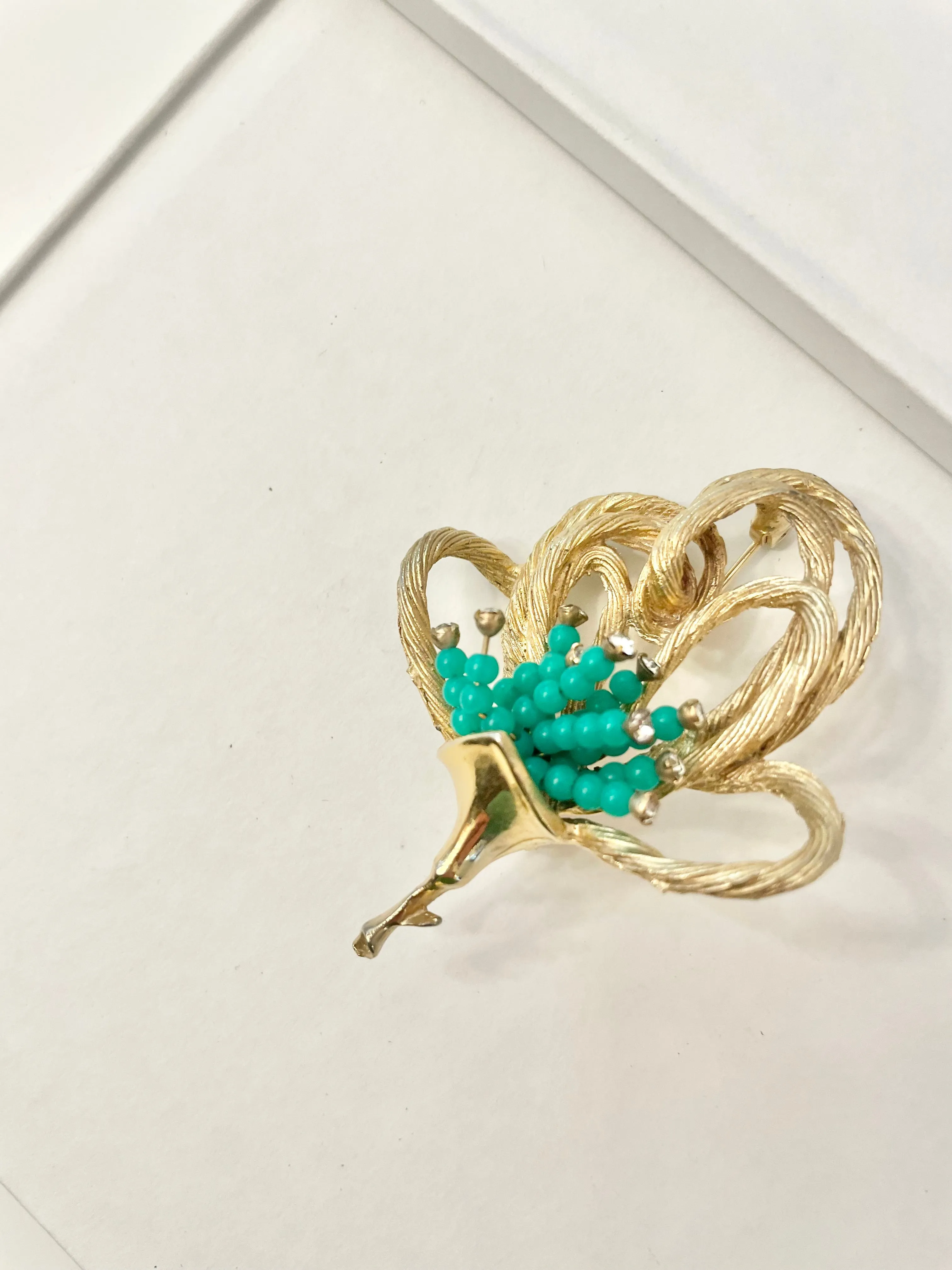 A truly classic brooch for a classy lady... love this bottle green beaded brooch with a sprig of clear glass stones, set in gold! so lovely