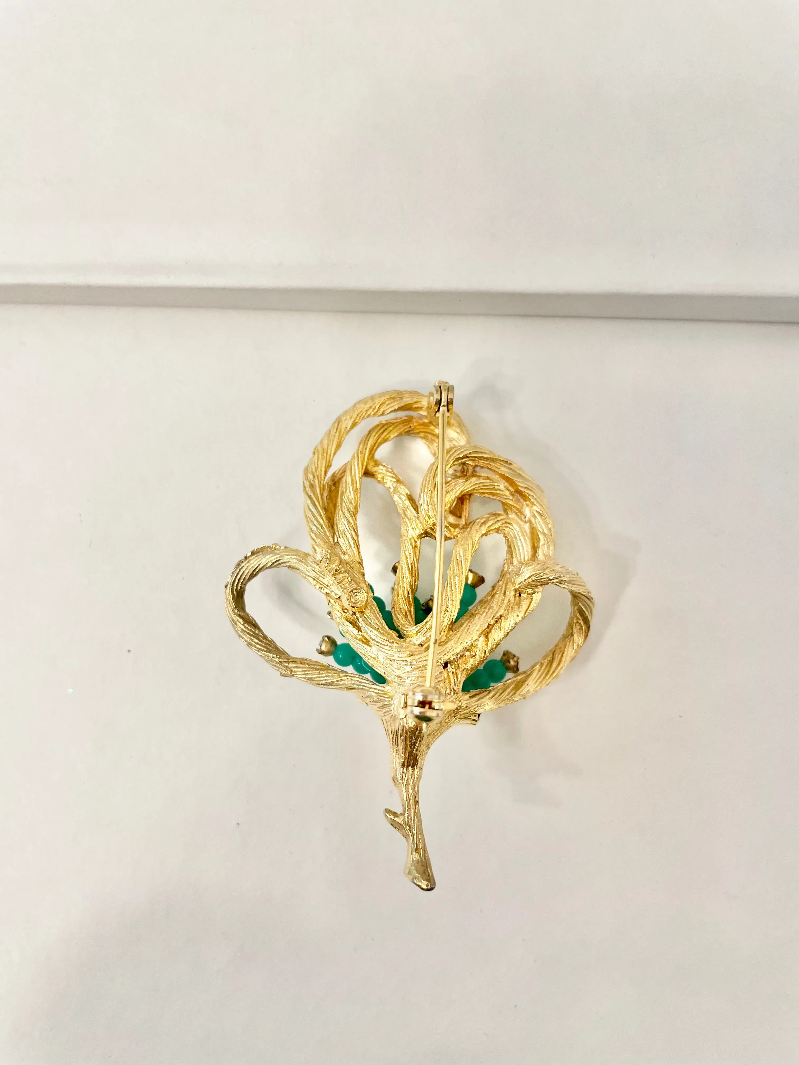A truly classic brooch for a classy lady... love this bottle green beaded brooch with a sprig of clear glass stones, set in gold! so lovely