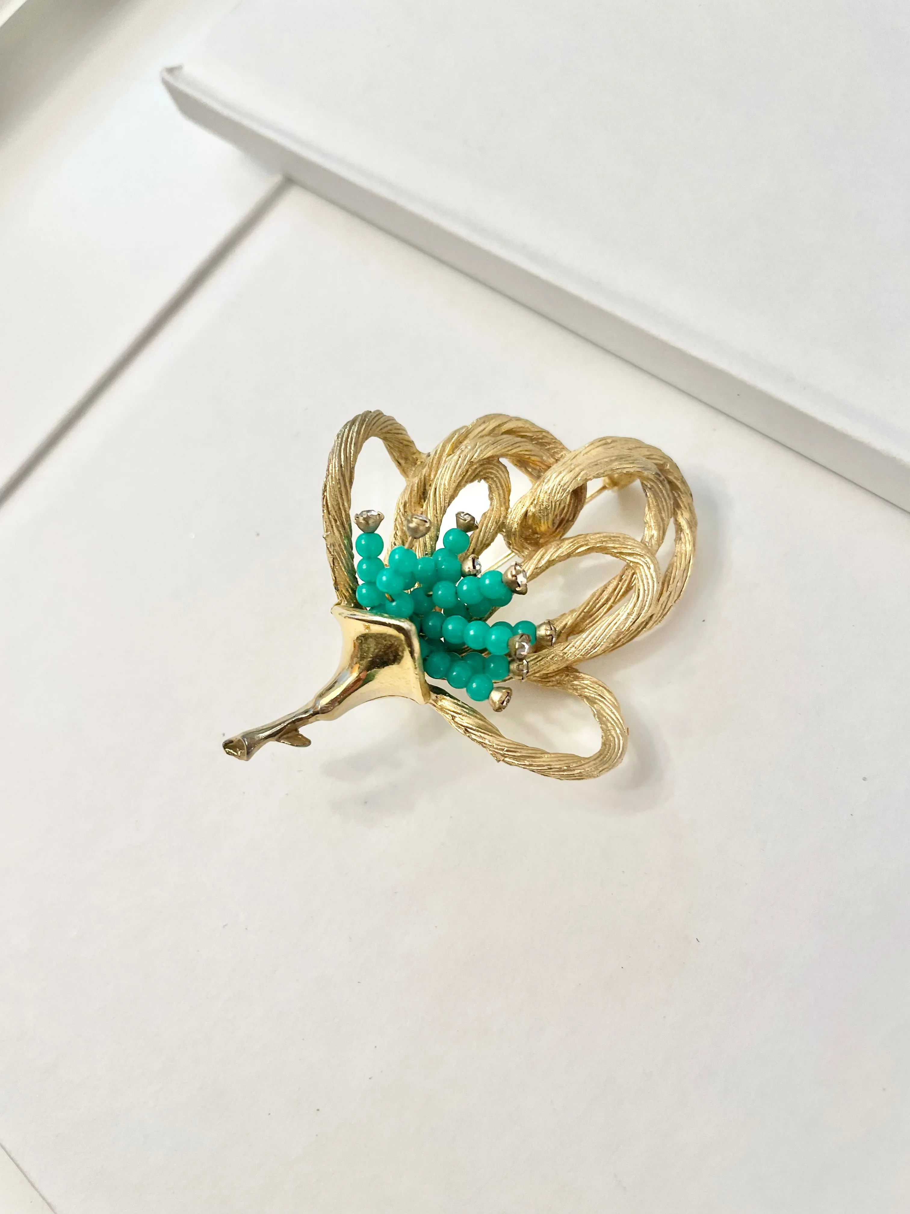 A truly classic brooch for a classy lady... love this bottle green beaded brooch with a sprig of clear glass stones, set in gold! so lovely