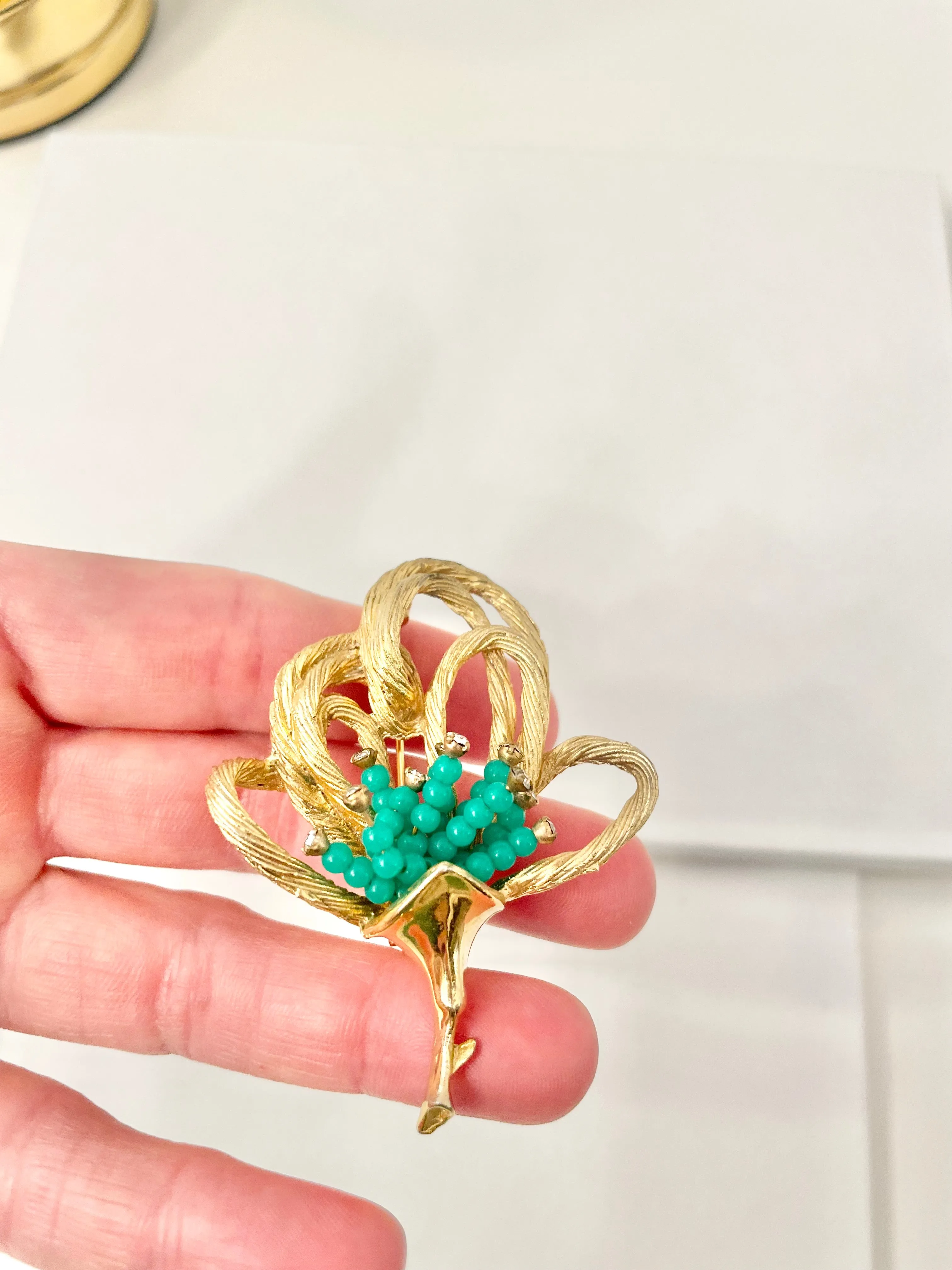 A truly classic brooch for a classy lady... love this bottle green beaded brooch with a sprig of clear glass stones, set in gold! so lovely