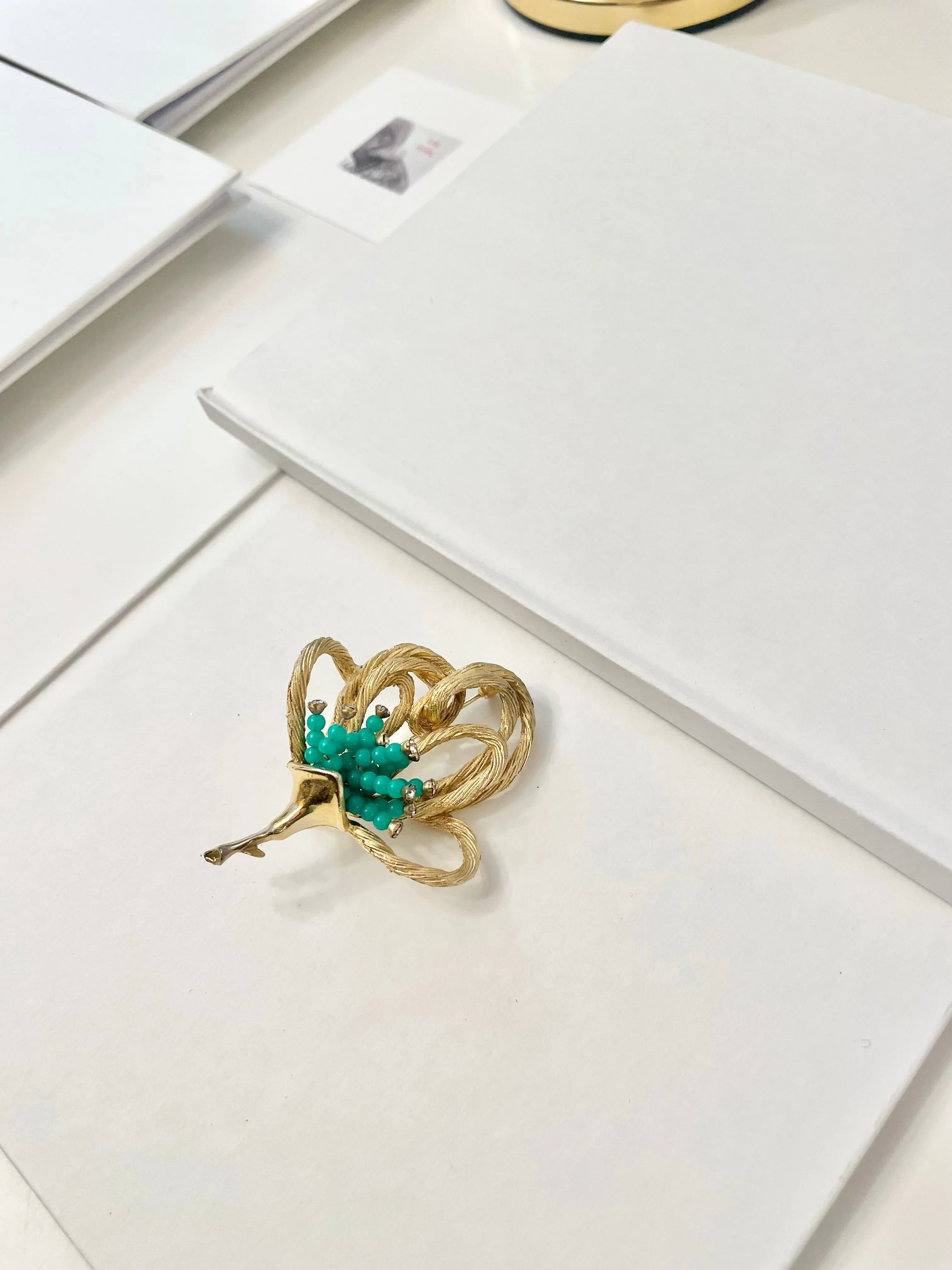 A truly classic brooch for a classy lady... love this bottle green beaded brooch with a sprig of clear glass stones, set in gold! so lovely